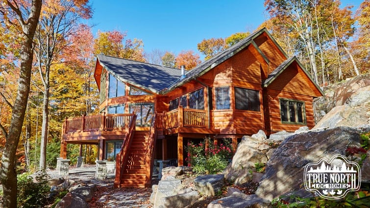 How are log homes more efficient than conventional homes?